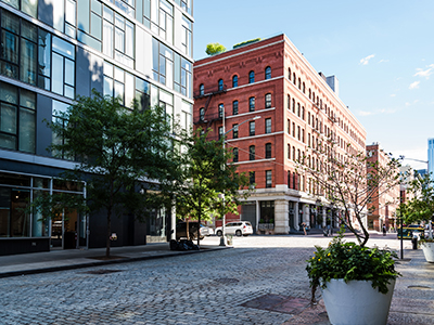 Street view, cobblestone road, buildings across the street