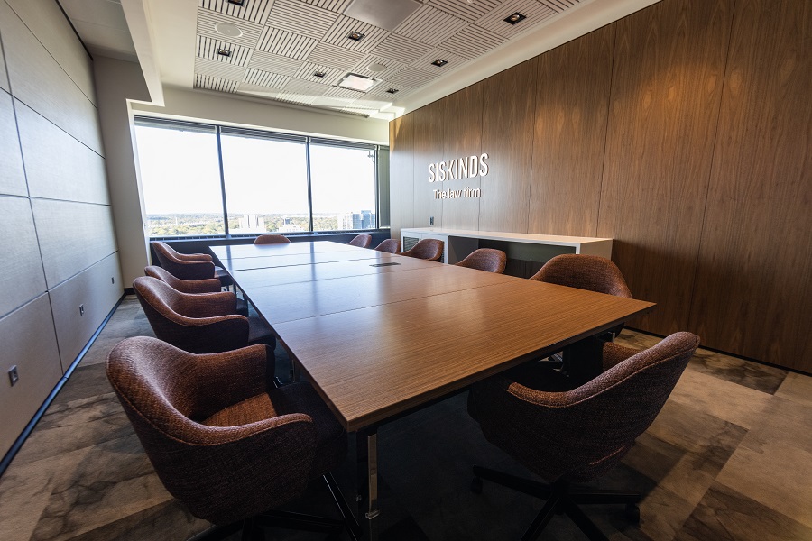 Siskinds board room with extra large table filling the room. 