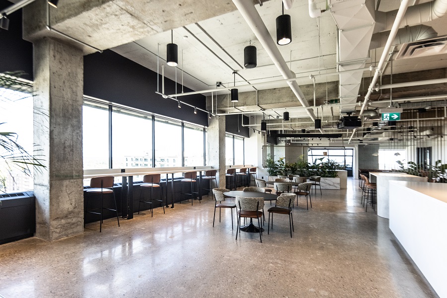 The Plaza - Siskinds' lunch area - with large windows and tall ceilings revealing ductwork.