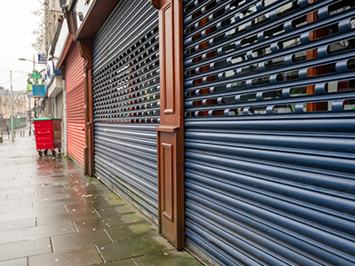 Street view of storefronts that are closed